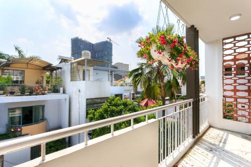 a balcony with a wreath of flowers on a building at Dlux Saigon in Ho Chi Minh City