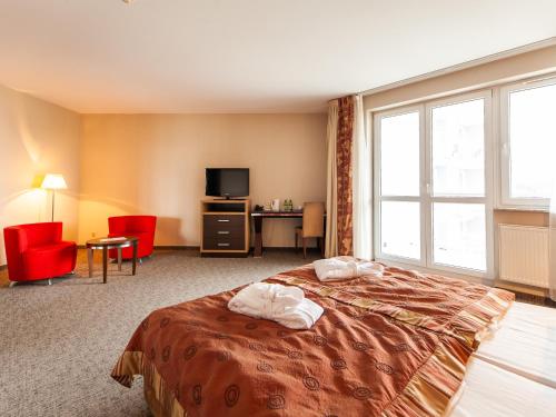 Apartament hotelowy Delux w Kołobrzeg Przy pobycie 7 nocy rabat 10 procent Przy pobycie 28 dni 30 procent rabatu 객실 침대
