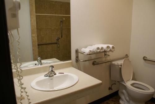 a bathroom with a sink and a toilet at Harborview Inn & Suites-Convention Center-Airport-Gaslamp-Seaworld-Zoo-Balboa Park in San Diego