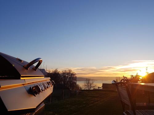 a view of the sunset from the back of a boat at Montreux Holiday Home in Montreux