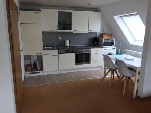 Η κουζίνα ή μικρή κουζίνα στο Ferienwohnung mit Whirlpool