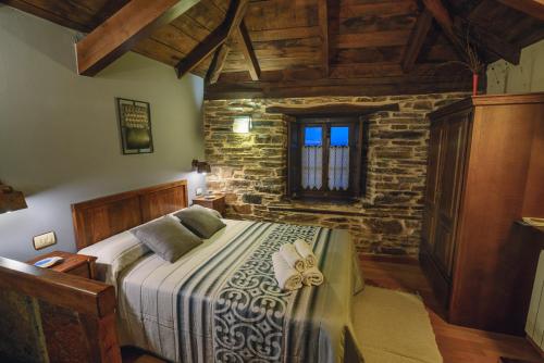 Katil atau katil-katil dalam bilik di Apartamentos Rurales Casa Riveras