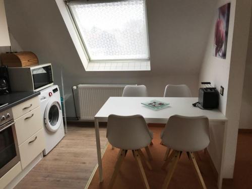 Η κουζίνα ή μικρή κουζίνα στο Ferienwohnung mit Whirlpool