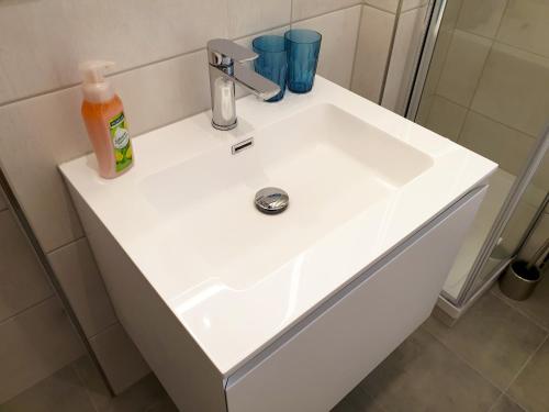 a white sink in a bathroom at Seeperle 2 in Meersburg