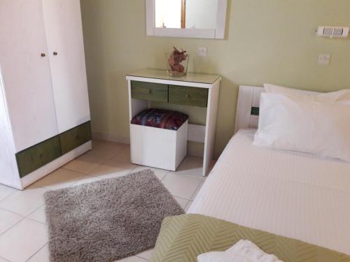 Ένα ή περισσότερα κρεβάτια σε δωμάτιο στο Epi Apartments