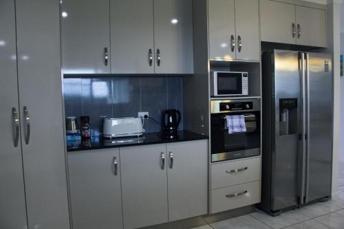 Kuchyň nebo kuchyňský kout v ubytování Family Friendly Holiday Home