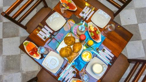an overhead view of a table with breakfast foods on it at Hotel La Basílica Quito in Quito