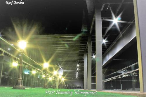 a row of lights in a stadium at night at H2H - Eleven14 Majestic Ipoh in Ipoh