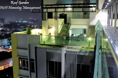 a balcony of a building with a view of a city at H2H - Eleven14 Majestic Ipoh in Ipoh