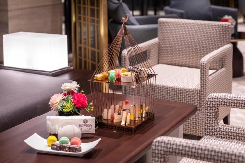 a coffee table with a table at Braira Al Nakheel in Riyadh