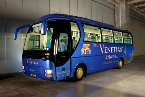 a blue bus is parked in a garage at The Venetian Macao in Macau