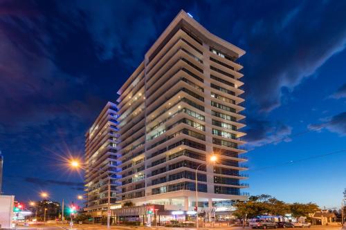 a tall building in a city at night at Wyndham Resort Surfers Paradise in Gold Coast