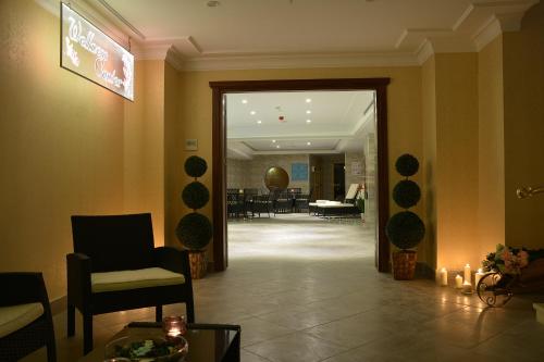 a lobby with a waiting room with chairs and a mirror at Askoc Hotel & SPA in Istanbul