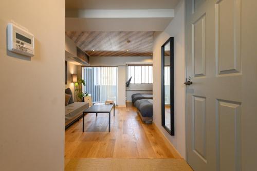 a living room with a couch and a table at Hotel Vintage Tokyo Tsukiji in Tokyo