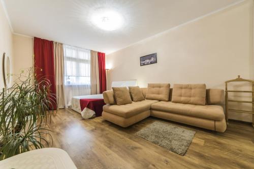 a living room with a couch and a bed at 1 Поверх ж к Паркові Озера метро Дарниця институт Серця МВЦ in Kyiv