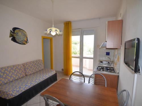 a living room with a couch and a table at lorecasa in Porto Garibaldi