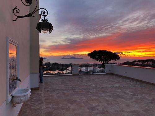 a view of a sunset from the balcony of a house at Villa De Cillis Carafa in Torre del Greco
