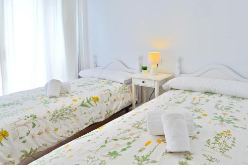 Postel nebo postele na pokoji v ubytování MyFlats Azul
