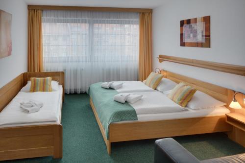 Un pat sau paturi într-o cameră la Hotel Oya