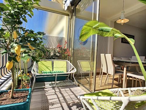 a balcony with chairs and a table and plants at Nestor&Jeeves - TOUCAN DUPLEX TERRACE - Hyper center - Top floor in Nice