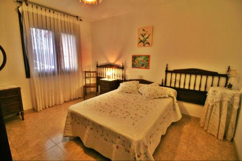 A bed or beds in a room at Apartamento Añon