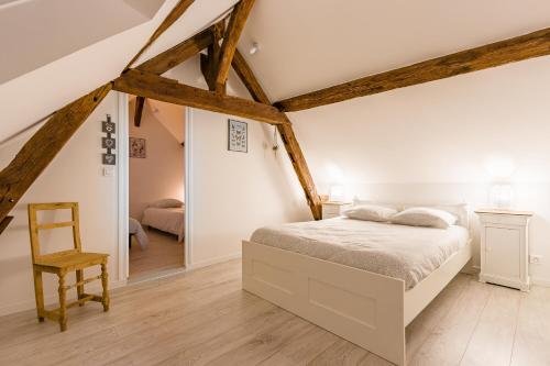 En eller flere senge i et værelse på La Parenthèse