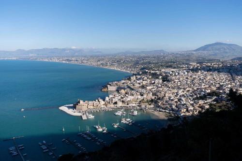 an aerial view of a harbor with boats in the water at Hotel La Piazzetta in Castellammare del Golfo