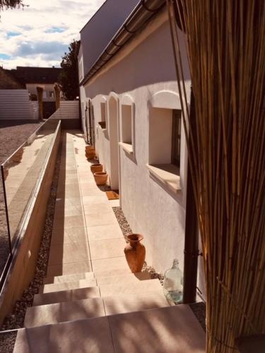 a building with a row of vases on the side of it at Presshaus Schützen in Schützen am Gebirge
