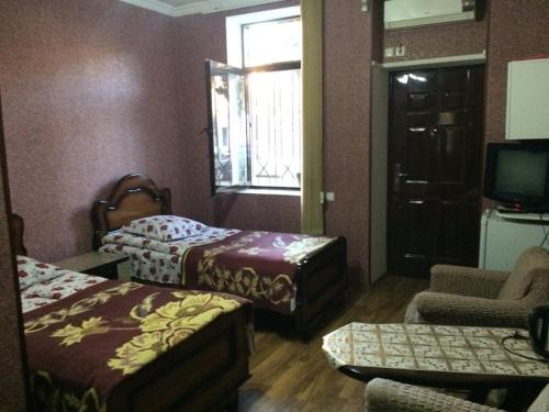 Ένα ή περισσότερα κρεβάτια σε δωμάτιο στο temuriRoom 558-58-78-27