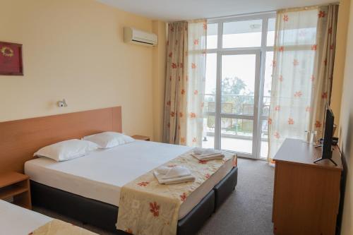 Postel nebo postele na pokoji v ubytování Hotel Eva
