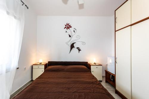 Ένα ή περισσότερα κρεβάτια σε δωμάτιο στο Sara Apartments Malinska