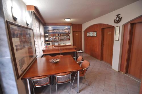 a dining room with a table and chairs at Villa Forum in Ohrid