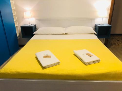 Ένα ή περισσότερα κρεβάτια σε δωμάτιο στο Al CINEMA ITALIA
