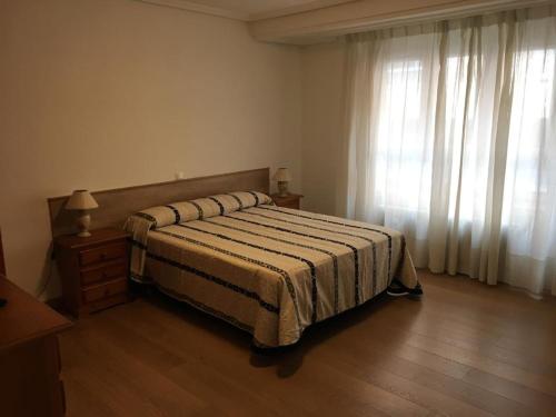 Ένα ή περισσότερα κρεβάτια σε δωμάτιο στο Habitaciones El Arco