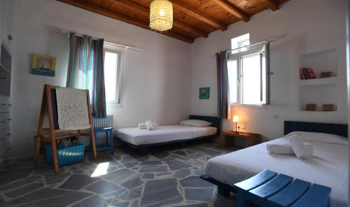 Ένα ή περισσότερα κρεβάτια σε δωμάτιο στο Villa Areti