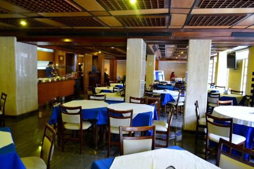 Reštaurácia alebo iné gastronomické zariadenie v ubytovaní Hotel Coliseo