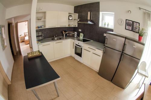 Кухня или мини-кухня в Buxusson Resort

