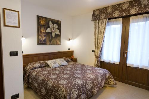 Ένα ή περισσότερα κρεβάτια σε δωμάτιο στο Affittacamere Verger Plein Soleil