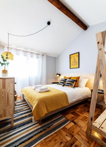 a bedroom with a large bed and a large window at BeachLiving Cortegaça in Cortegaça