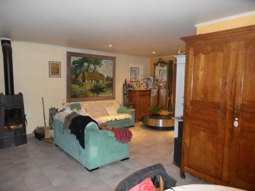 a living room with a couch and a fireplace at L'OLIVERAIE EN PROVENCE in Lambesc