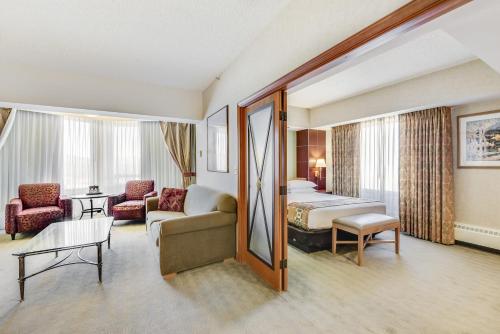 a hotel room with a bed and a couch at Harrah's Lake Tahoe Hotel & Casino in Stateline