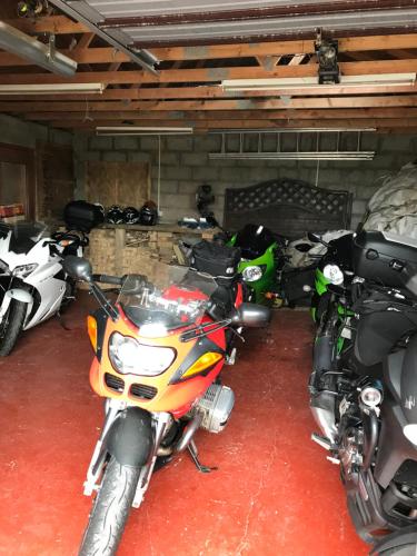 a group of motorcycles parked in a garage at Ardconnel Bed and Breakfast in Kirkwall