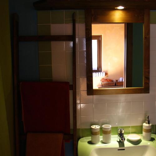 a bathroom with a sink and a mirror at B&B Scacciapensieri - Vini d'Altura in Colledara