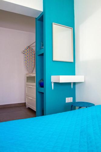 Katil atau katil-katil dalam bilik di Rainbow Apartments