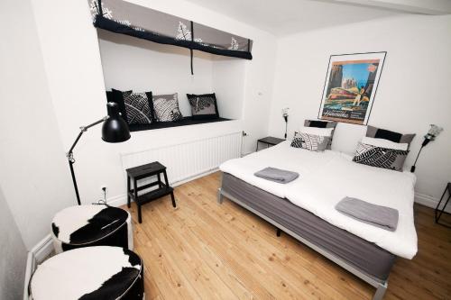 a bedroom with a bed and a desk and a lamp at City Backpackers Hostel in Stockholm