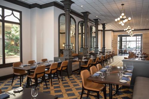 a row of tables and chairs in a restaurant at Fairmont Washington DC Gold Experience in Washington