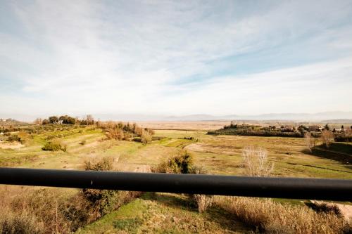 a view of a field from a fence at La terrazza del Bimbo in Fucecchio