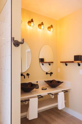 a bathroom with two sinks and a mirror at The Barn B&B Walla Walla in Walla Walla