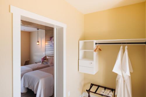 a bedroom with a bed and a closet with a mirror at The Barn B&B Walla Walla in Walla Walla