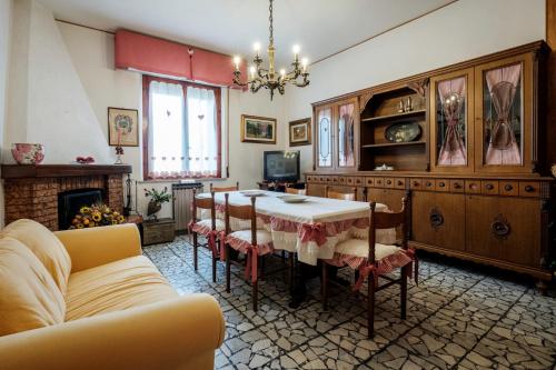 a living room with a table and a couch at La terrazza del Bimbo in Fucecchio
